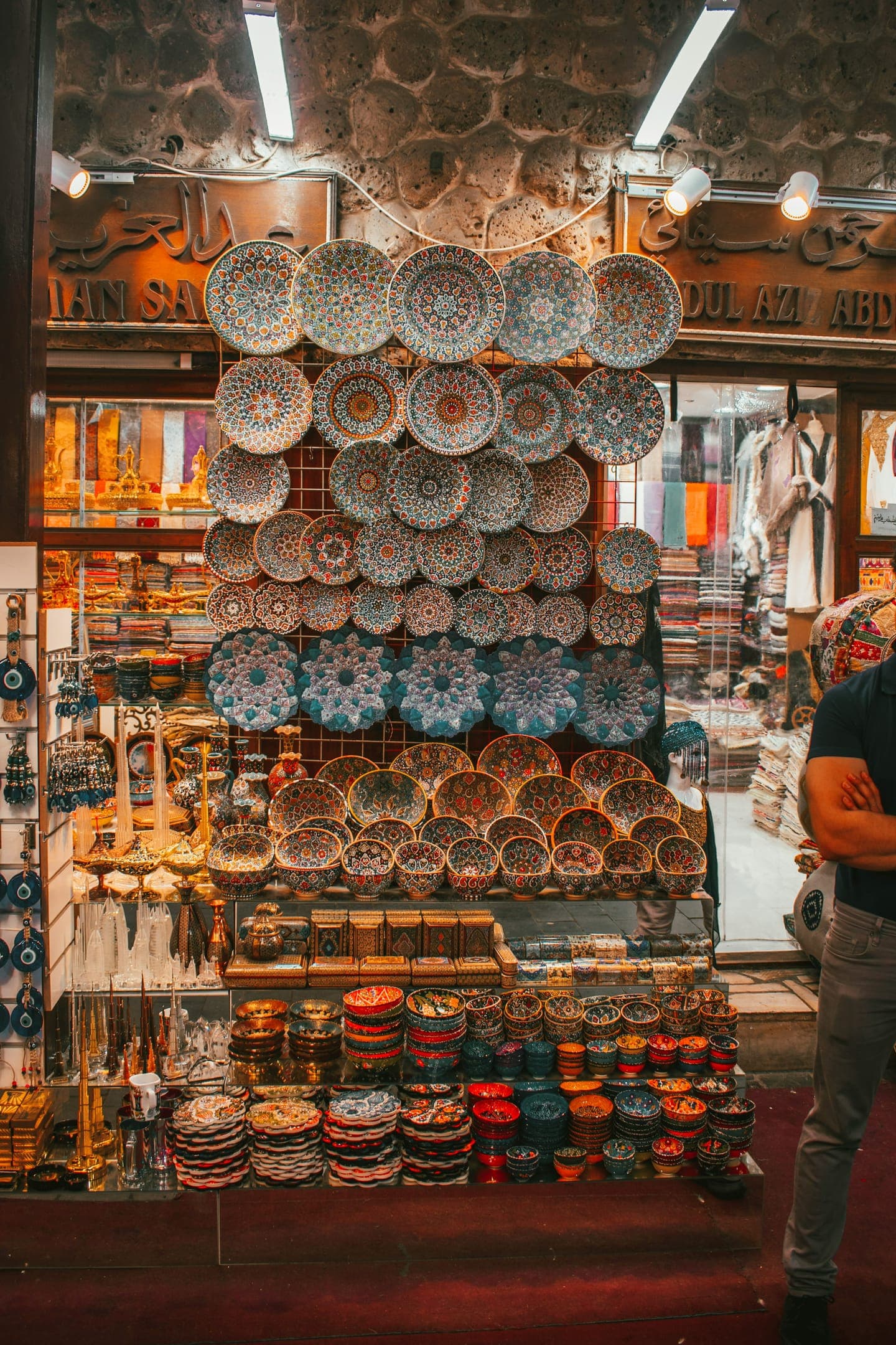 Painted plates and bowls stacked in a shop
