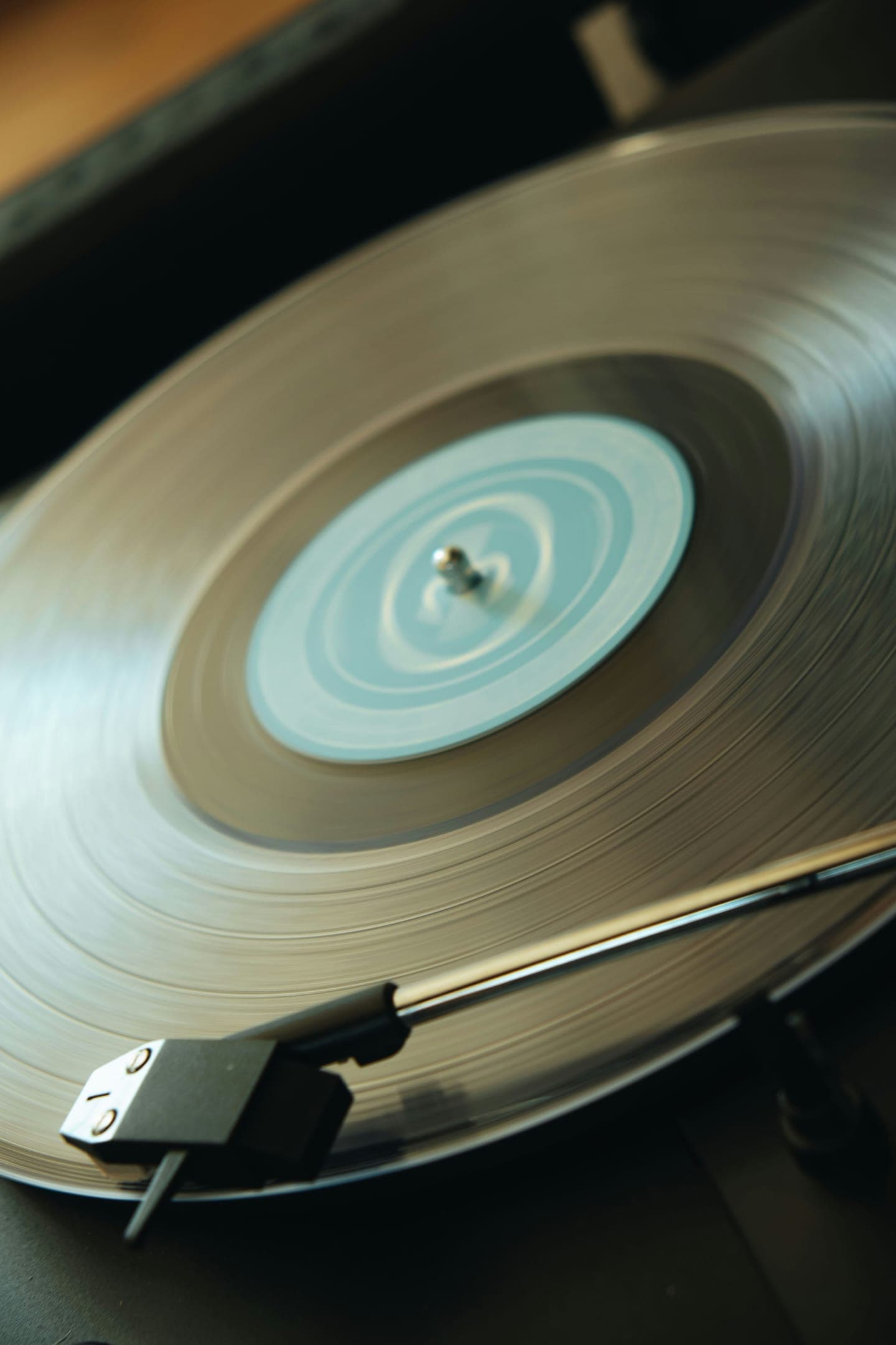A tonearm resting on a vinyl record